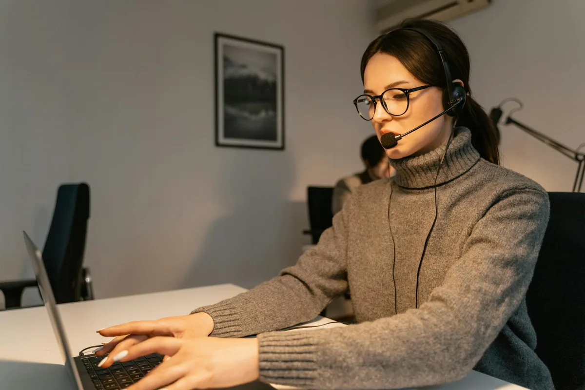 Person at a desk getting support help on their laptop for their online store