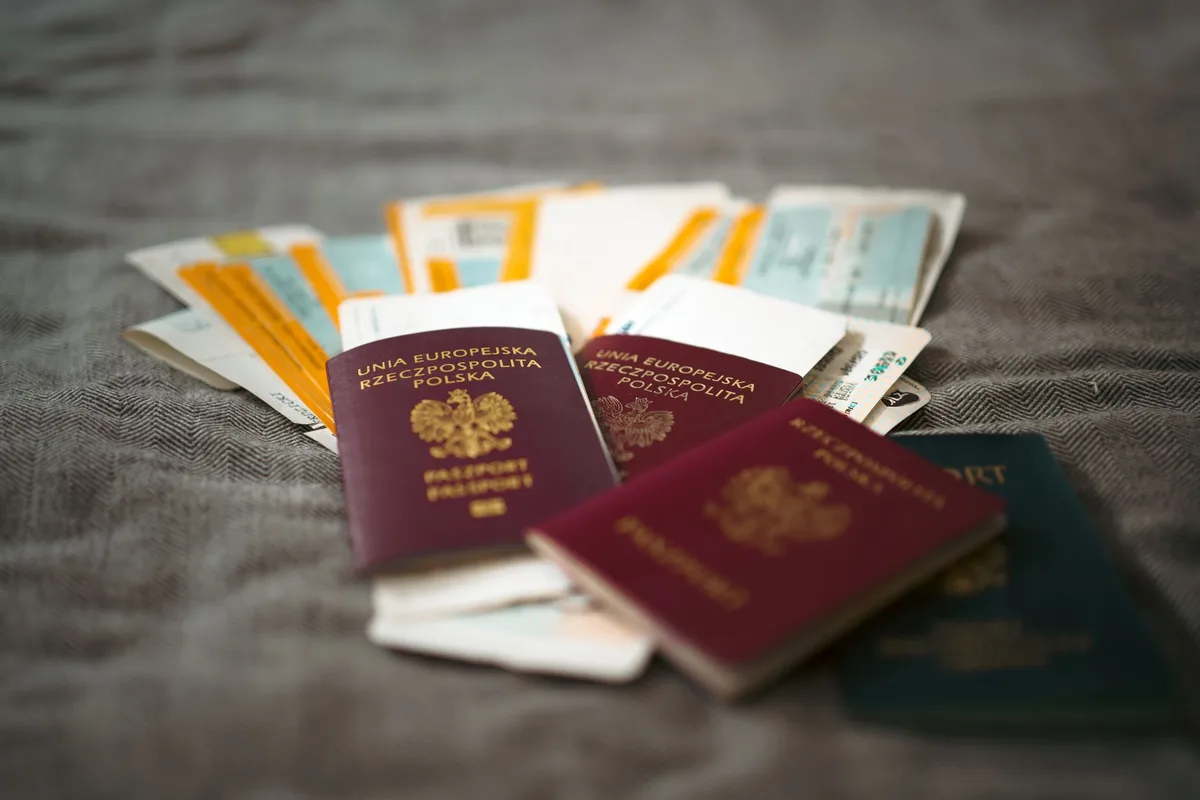 Passports and travel documents on a desk representing a UAE e-commerce license visa application