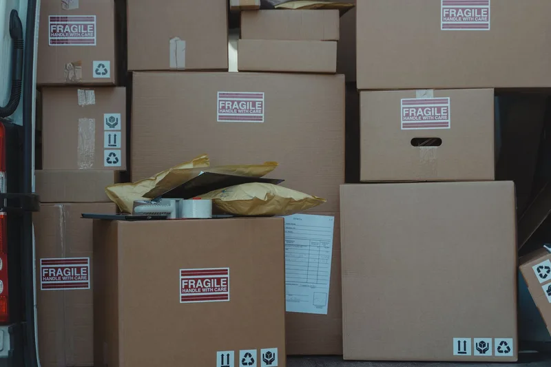 Stacked cardboard shipping boxes representing marketplace order fulfillment