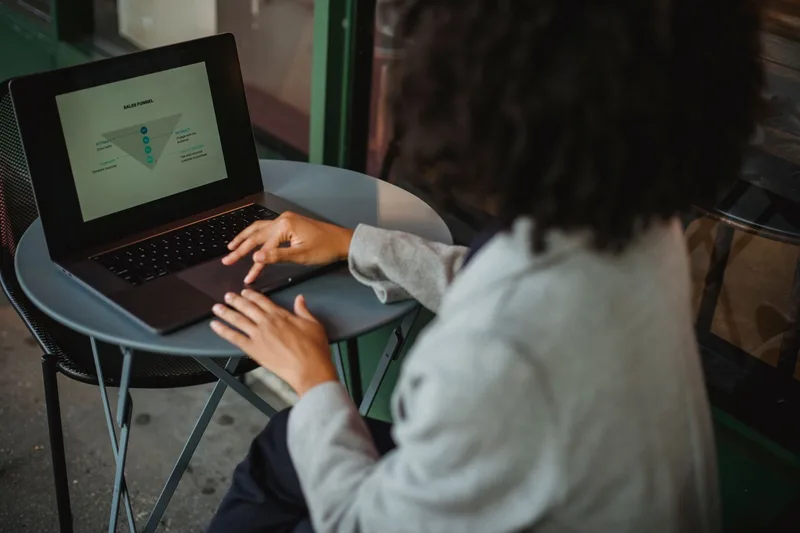Person working on a laptop representing setting up an online store