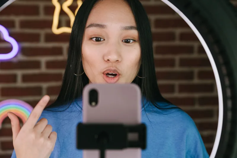 Seller promoting a new product on social media using a smartphone