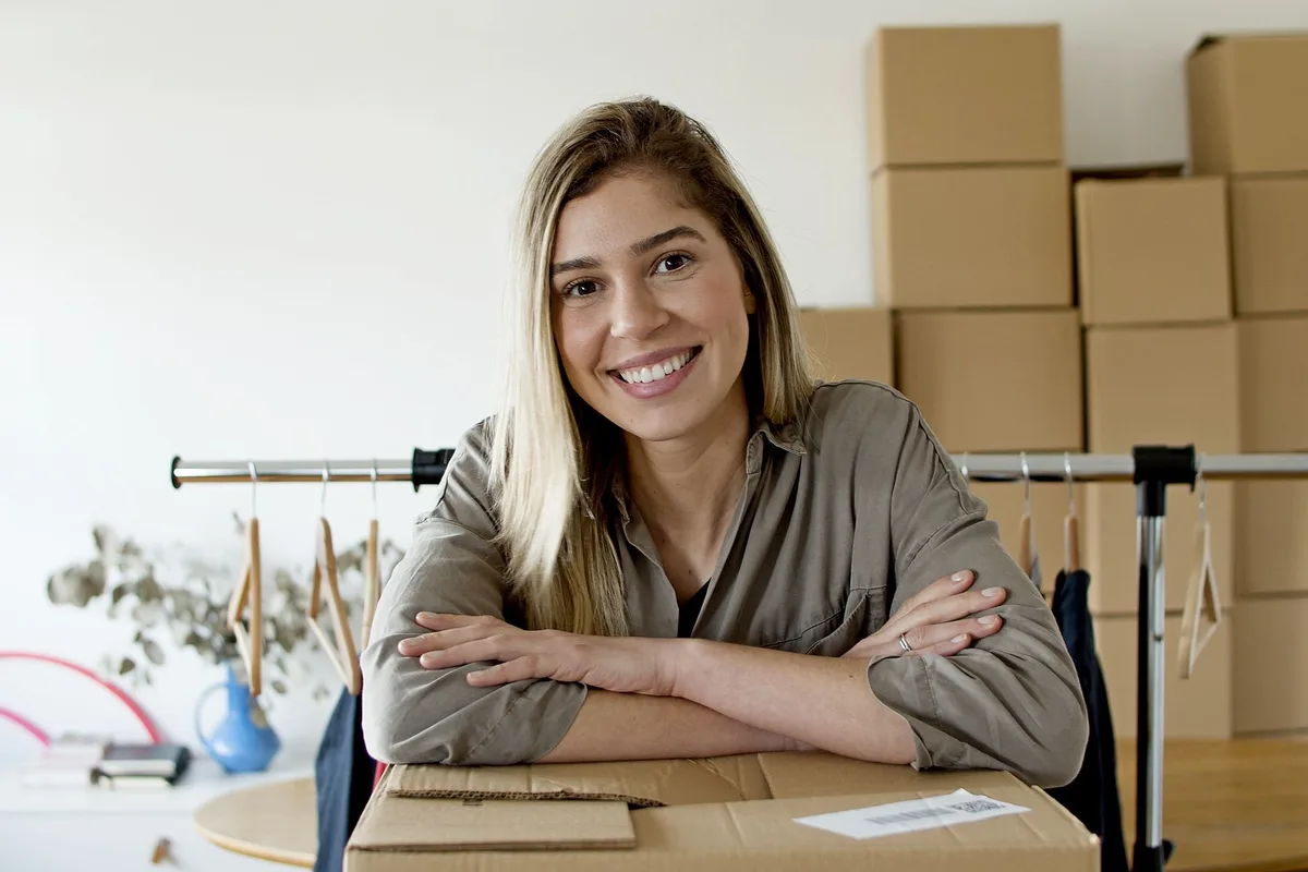 Filipino entrepreneur managing her online store with packages ready for her first Lazada Philippines order