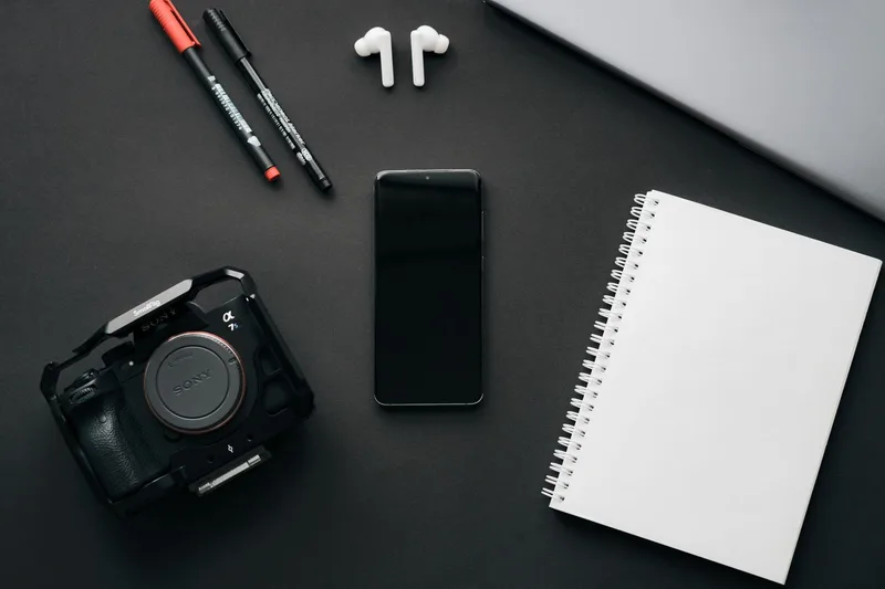 Flatlay of a smartphone and product on a clean background, set up for online product photos